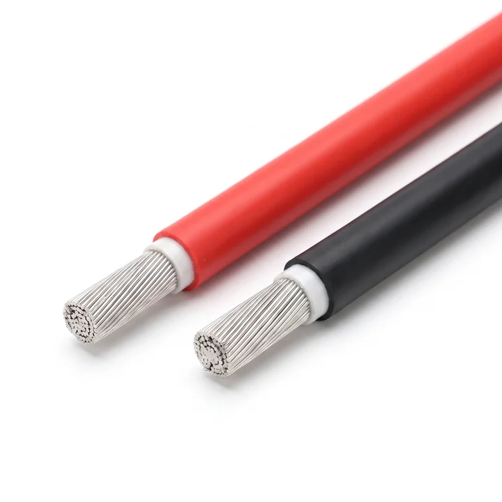 Single-core H1Z2Z2-K photovoltaic DC cable in red and black, cut to show tinned fine-stranded copper under a white cross-linked insulation layer